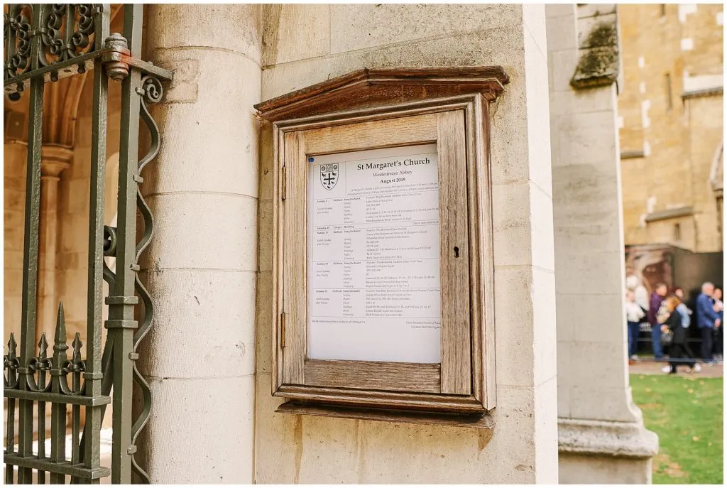 St Margaret's Church sign on stone wall in central London 