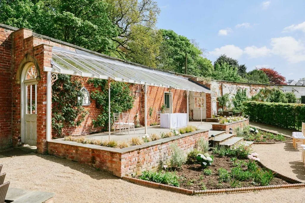 Exterior photo of the outdoor ceremony loggia at Pippley Walled Garden