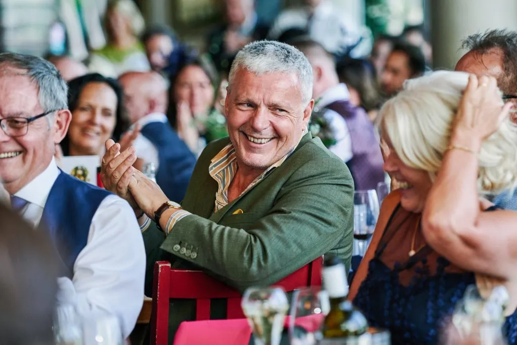 Wedding guest laughing at The Oyster Shed in London