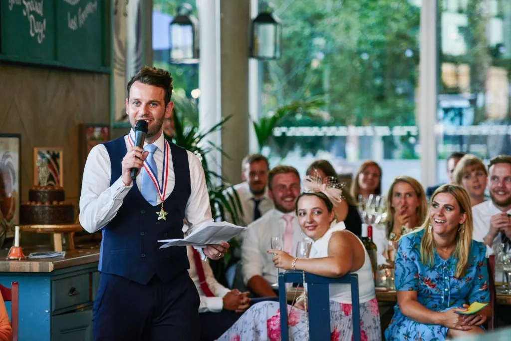 Usher giving a speech during wedding reception at The Oyster Shed