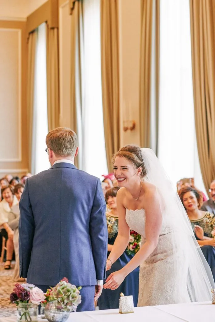bride and groom smiling during their fun winter ceremony