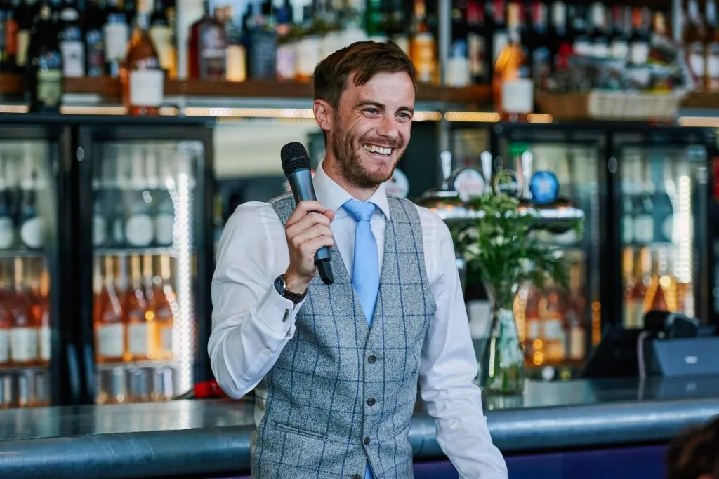 happy groom laughing during his speech at The Oyster Shed