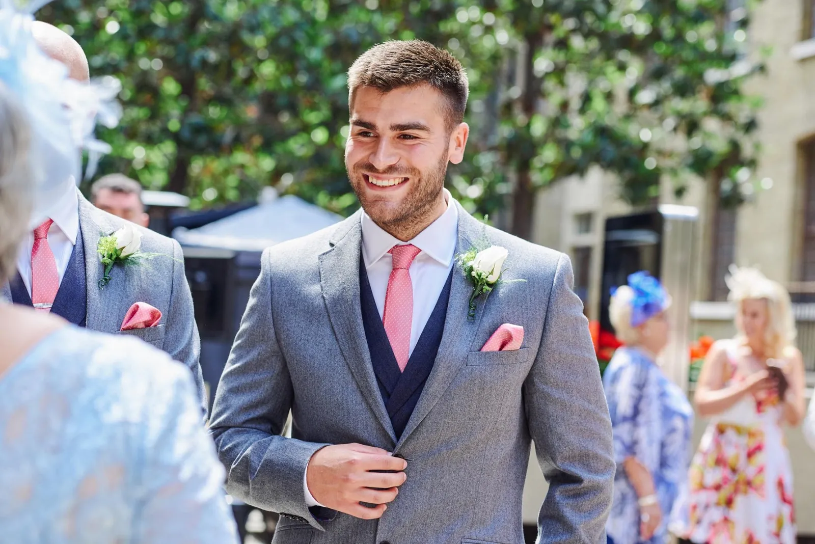 best man smiling during summer courtyard wedding at Devonshire Terrace