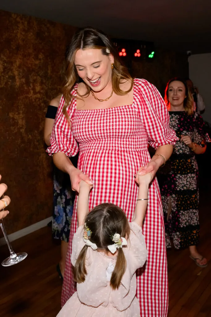 mother dancing with child during woodborough hall wedding party
