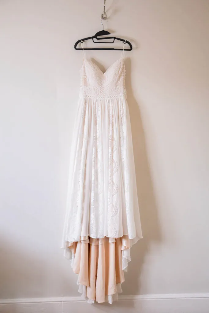 wedding dress hanging in bridal suite at woodborough hall