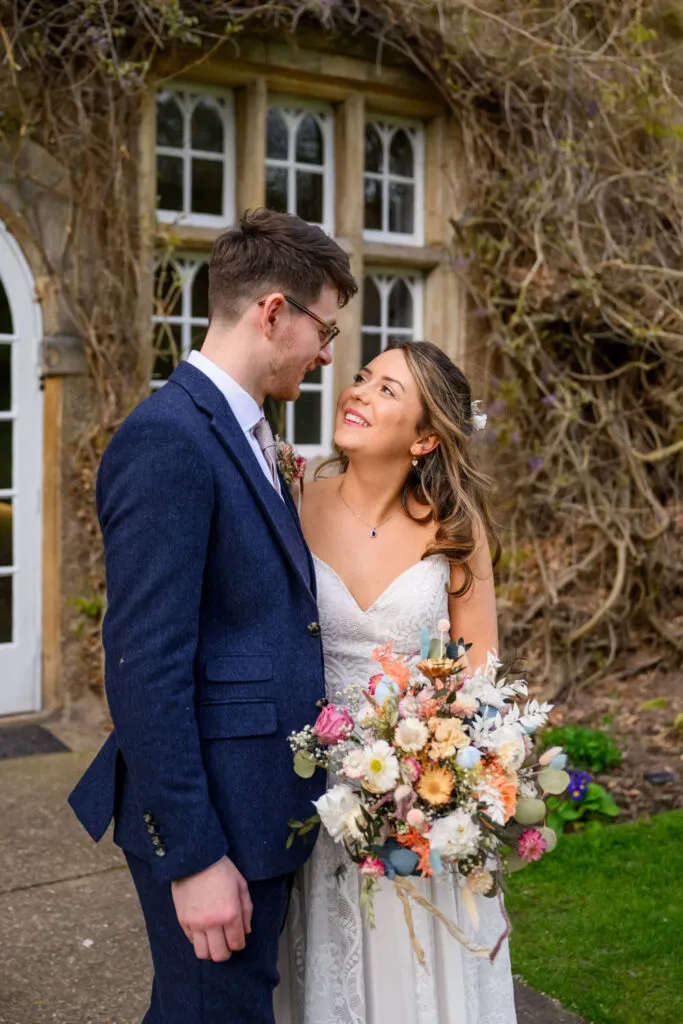 romantic couple portrait outside historic woodborough hall wedding venue