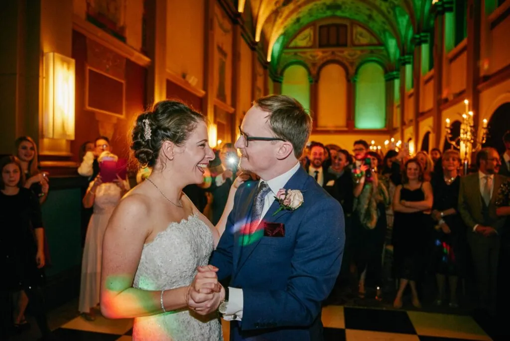 Happy bride and groom during their first dance in the chapel at Beaumont Estate