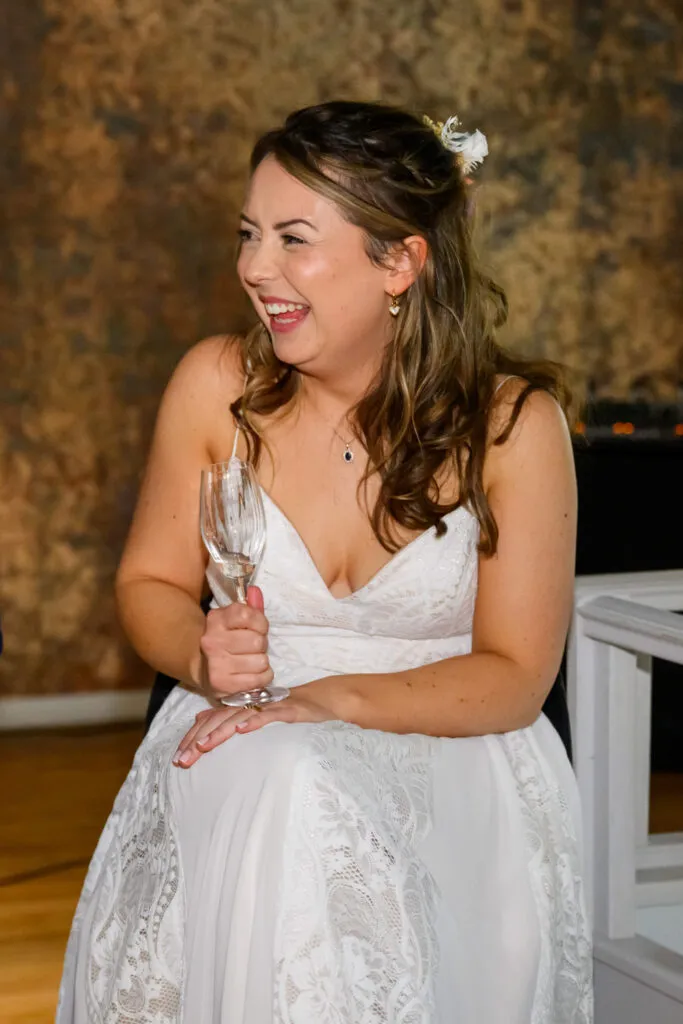 bride laughing during speeches woodborough hall wedding