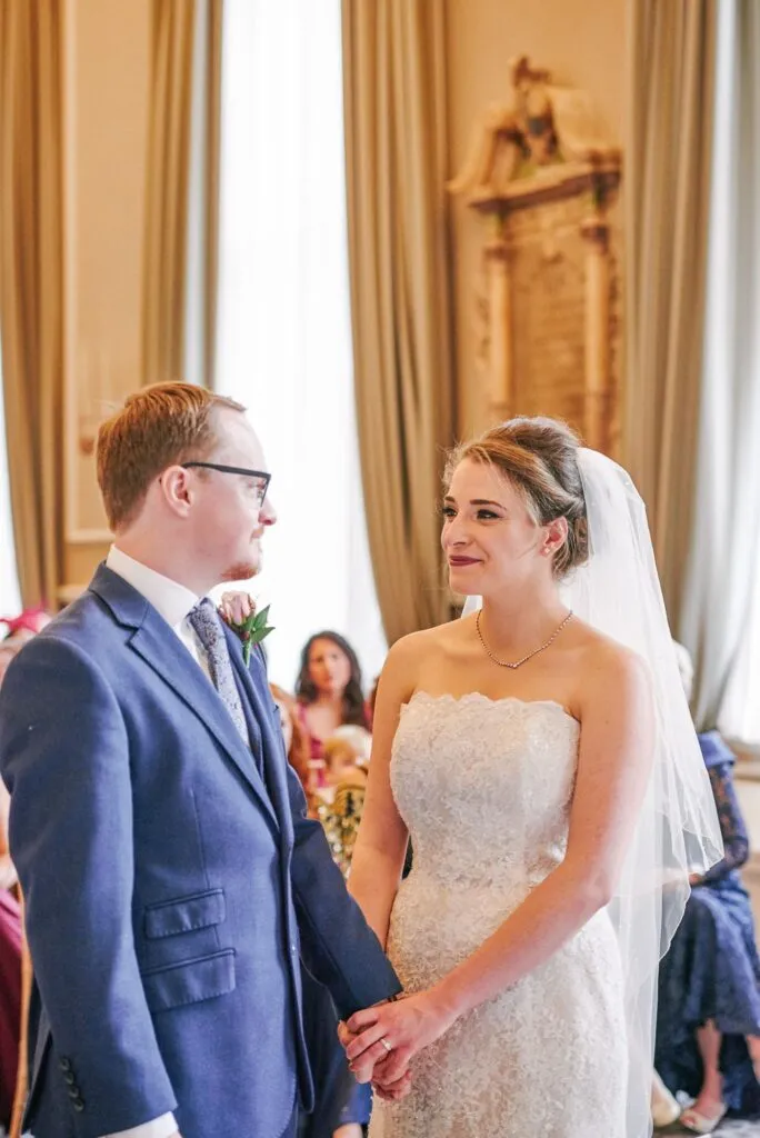 bride and groom smiling during their fun winter ceremony