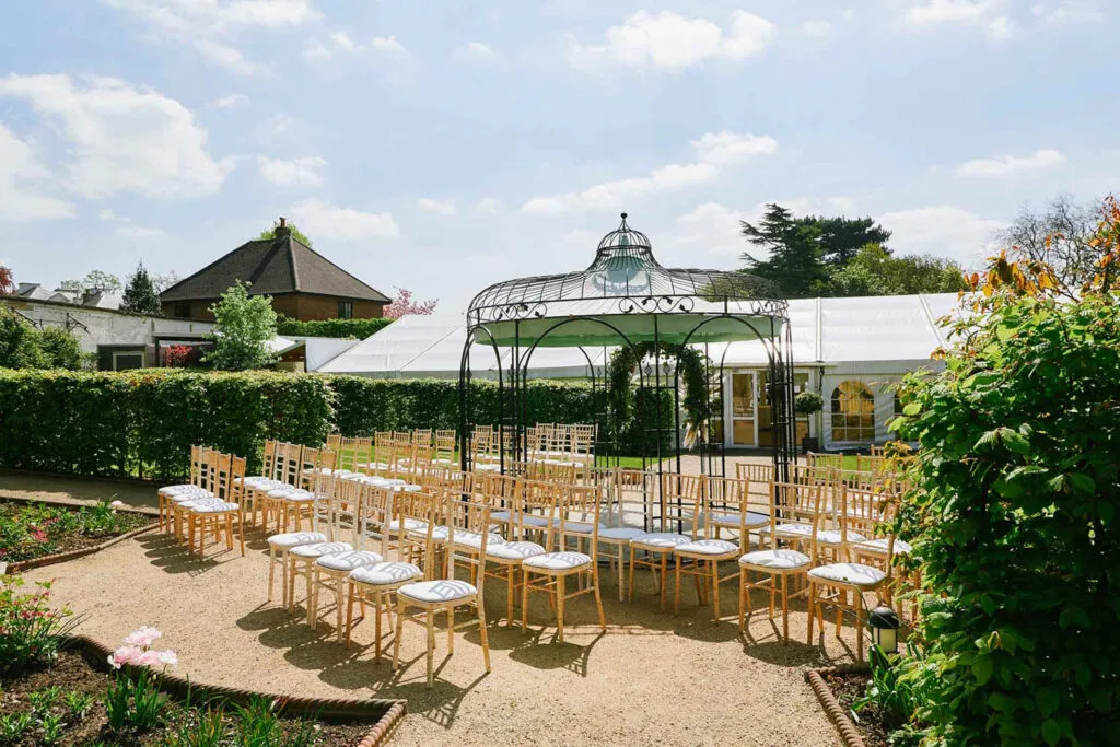 wide photo of the outdoor ceremony seating at Pippley Walled Garden