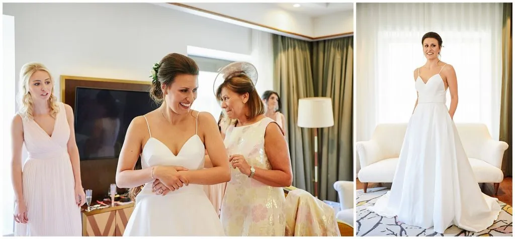 Bride posing in her wedding dress and smiling in hotel room in London