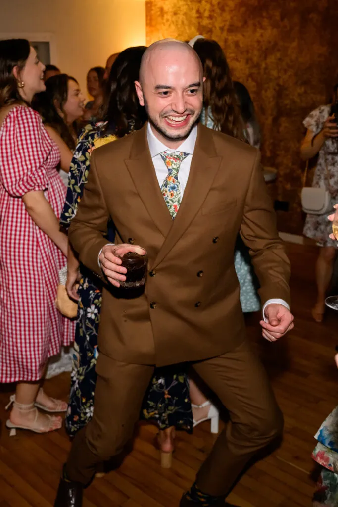 guest dancing during woodborough hall wedding evening reception