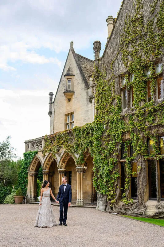 bride and groom walking in front of nottingham wedding venue