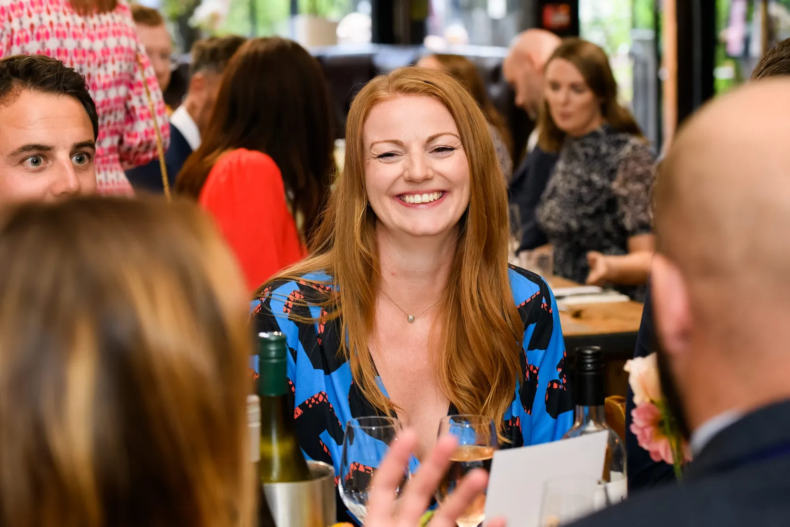 female guest laughing during The Depot N7 wedding reception meal