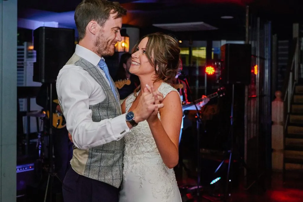 Bride and groom smiling during first dance at The Oyster Shed in London 