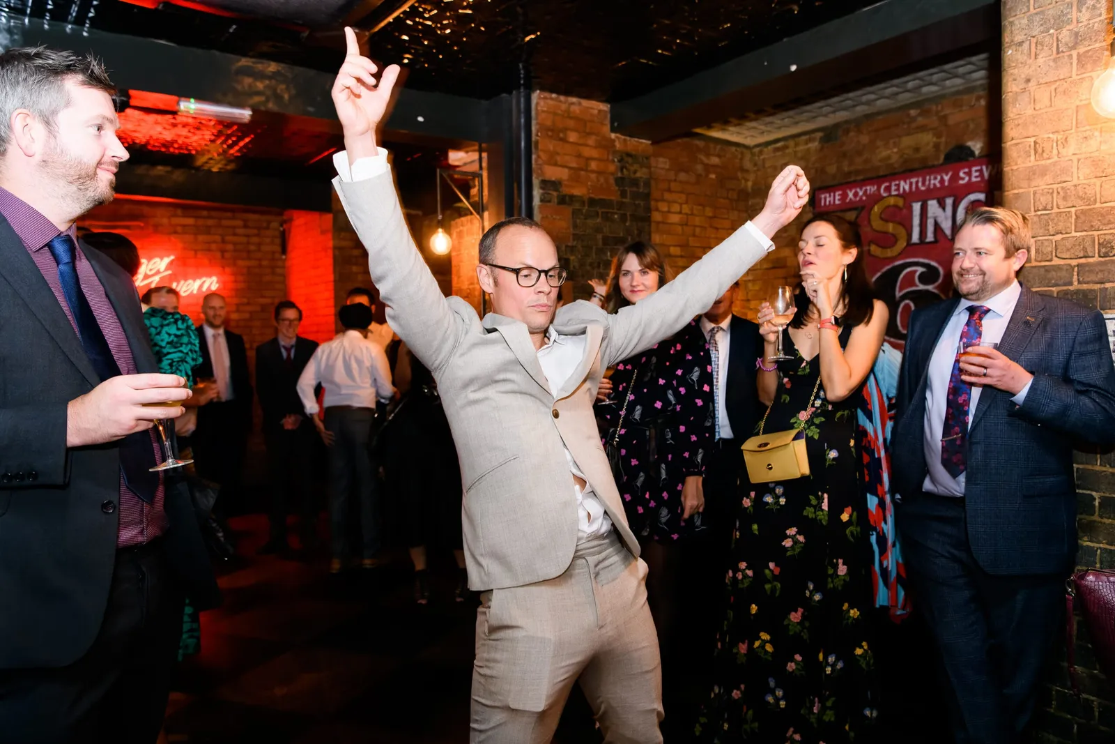 Wedding guest dancing in the Singer Tavern Basement