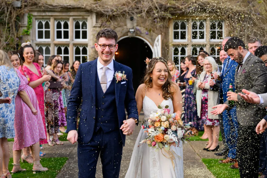 joyful confetti exit at woodborough hall wedding ceremony