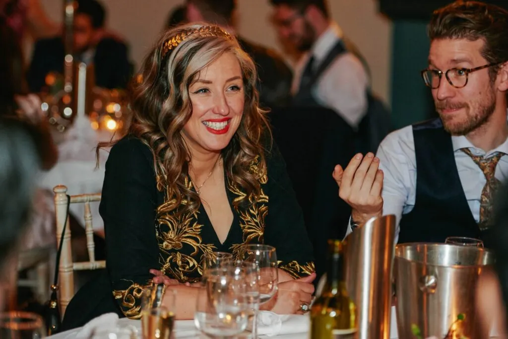 wedding guest laughing during speeches at De Vere Beaumont Estate