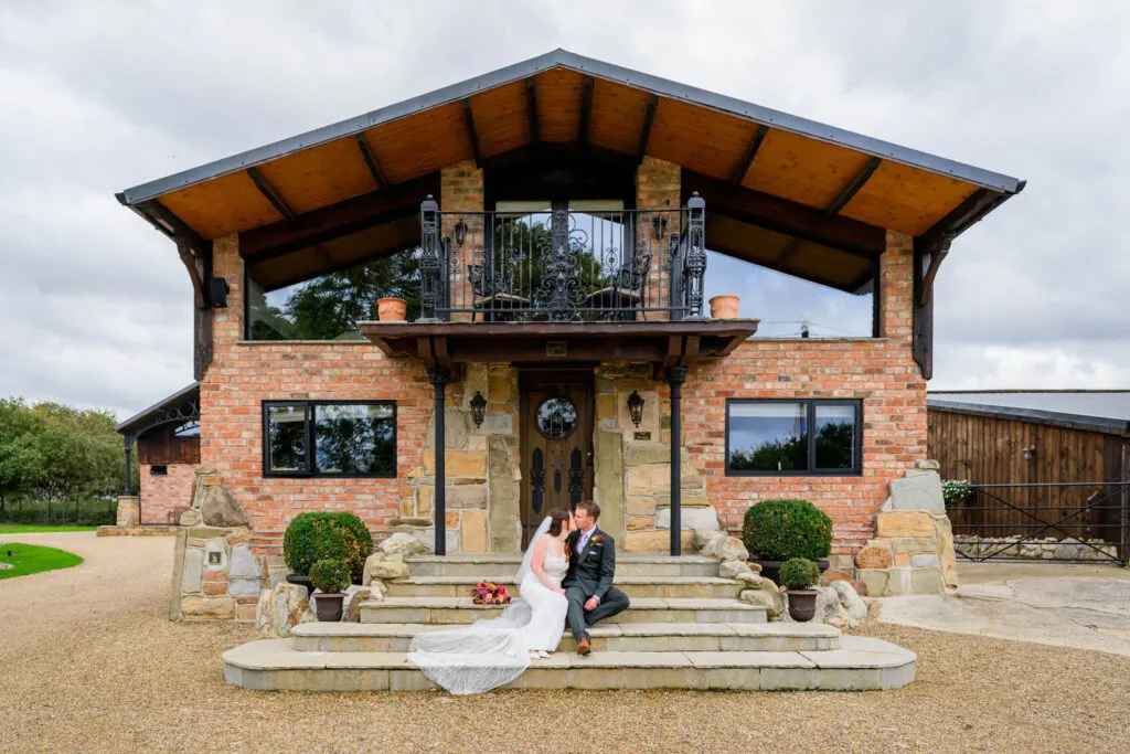 Bride and groom portrait outside Willow Marsh Farm wedding venue in Nottinghamshire