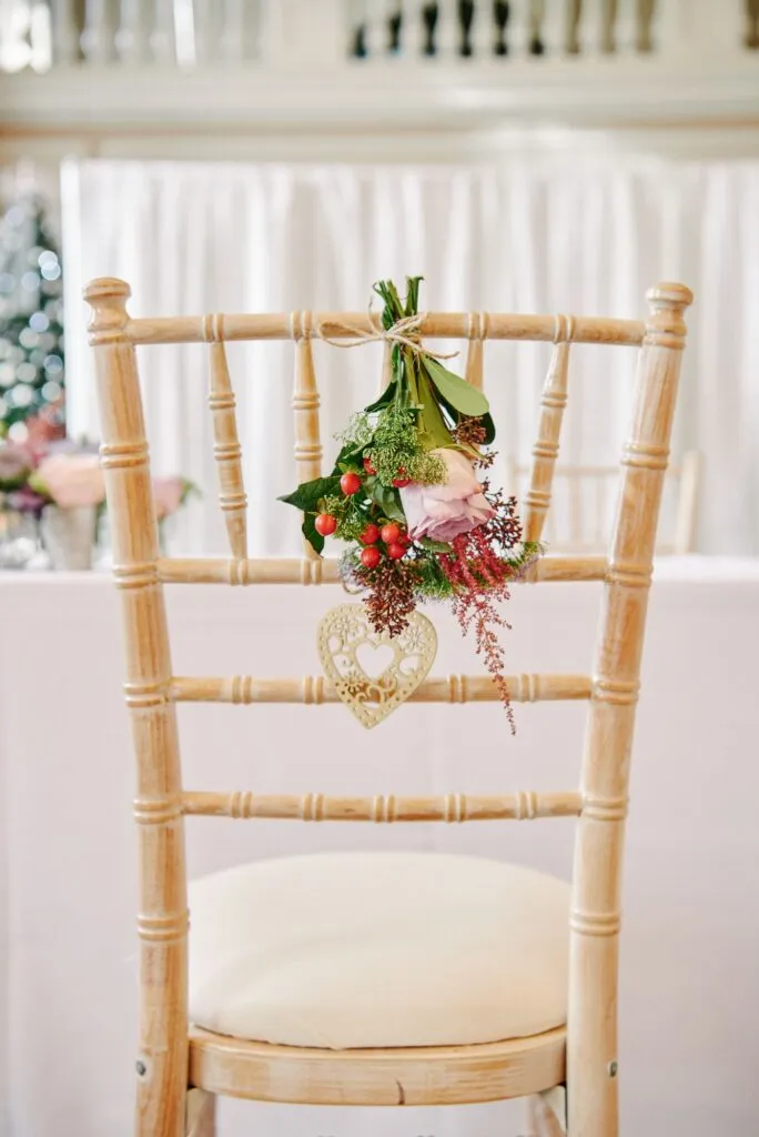 flowers hung on wooden chair