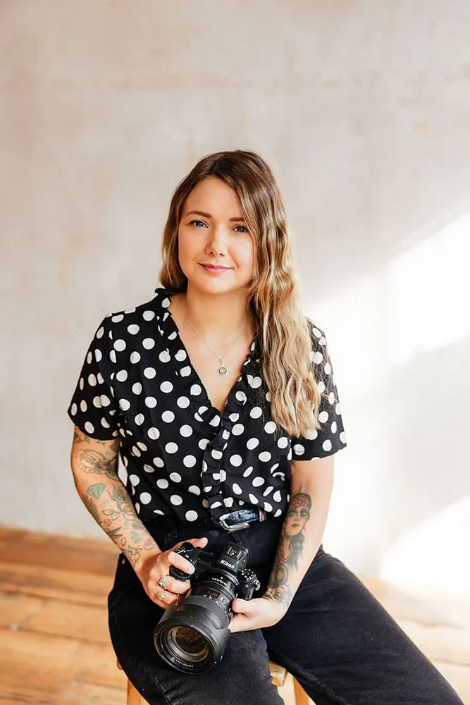 nottingham wedding photographer Sally rose holding a camera