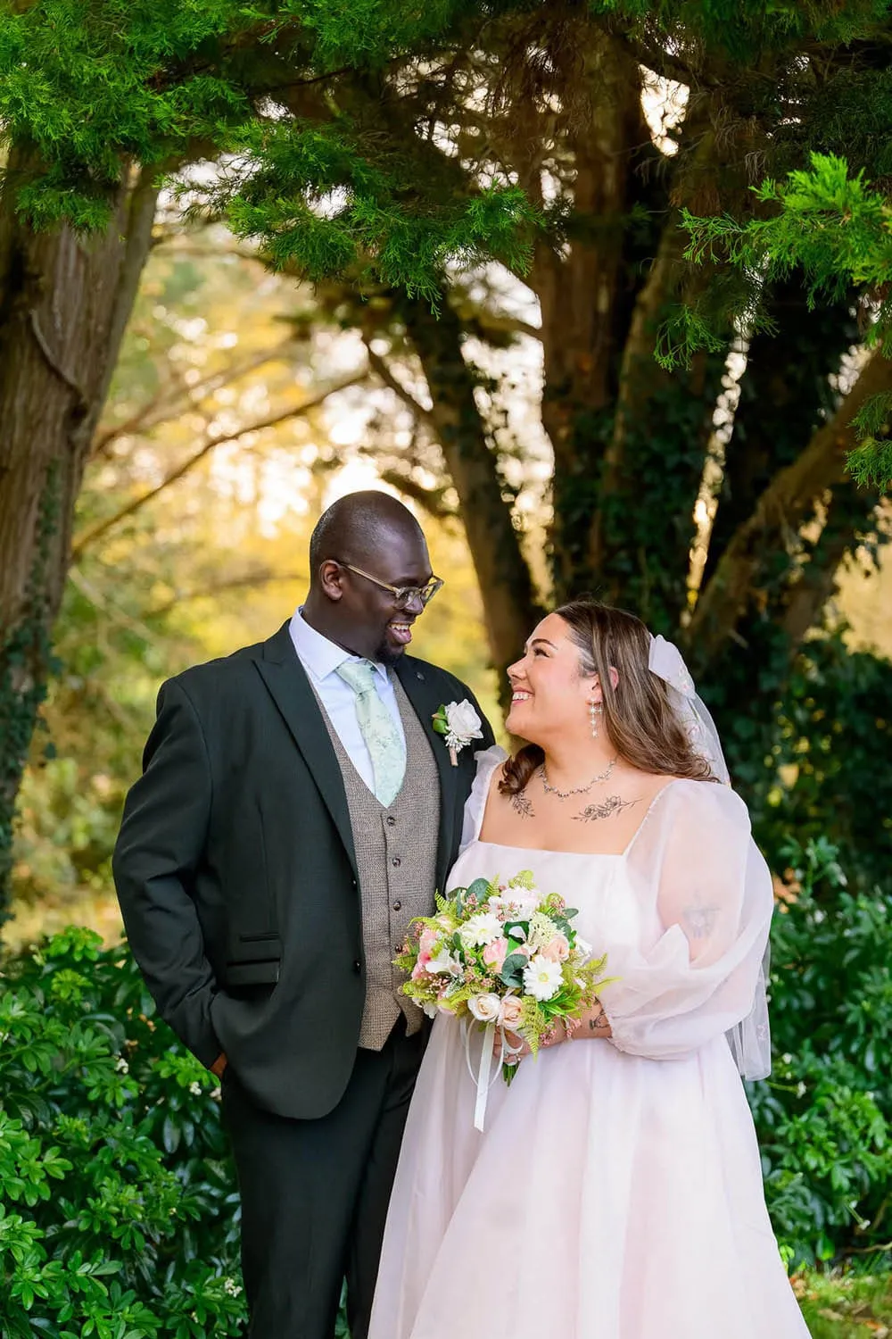 Bride and groom smiling during golden hour at Hazel Gap Barn