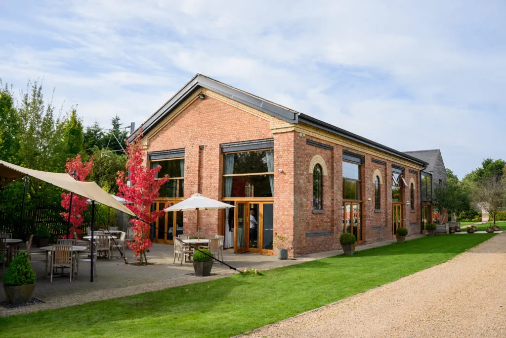 Wedding photography featuring Carriage Hall wedding venue on sunny day
