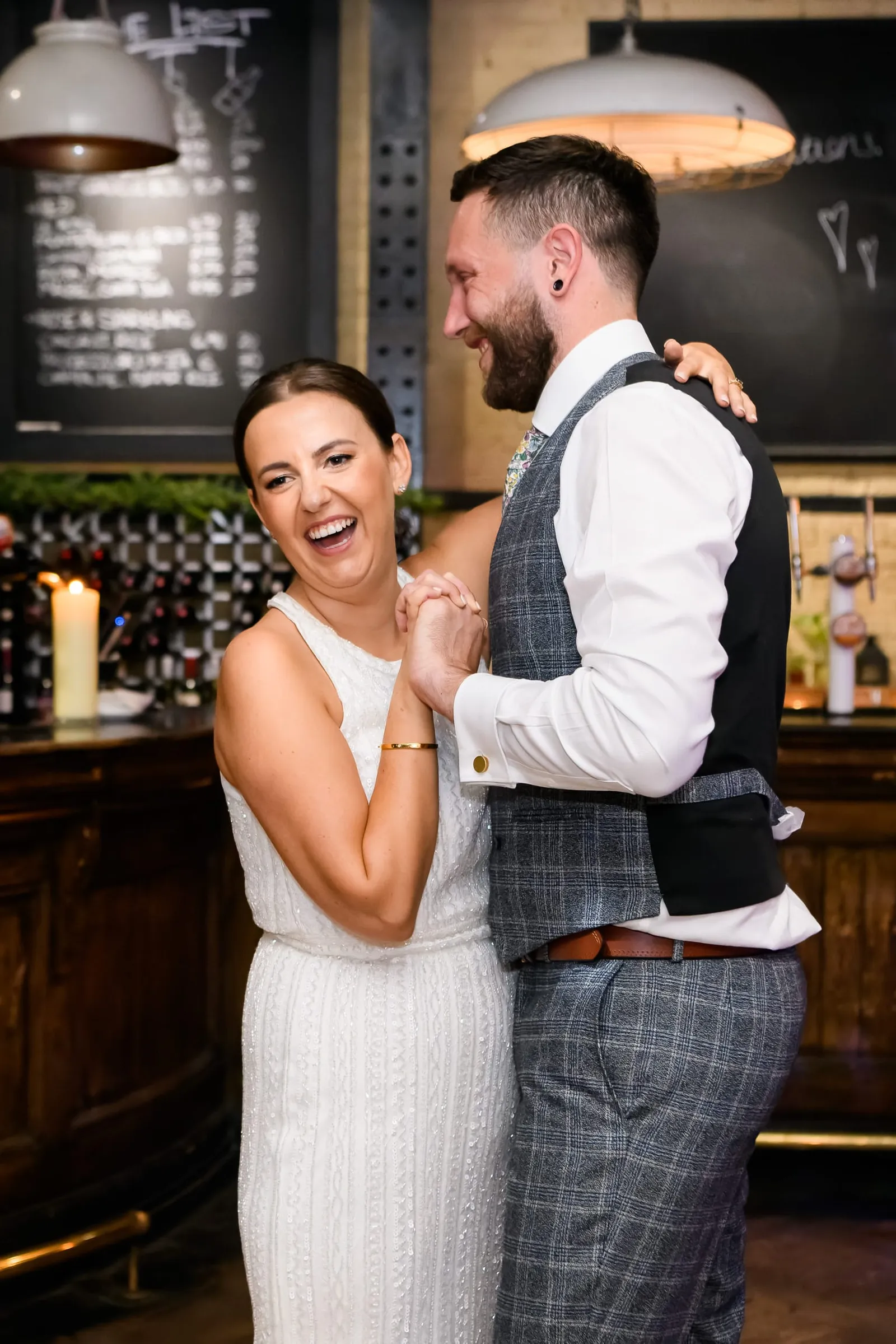 Bride and groom laughing during their first dance at The Depot N7