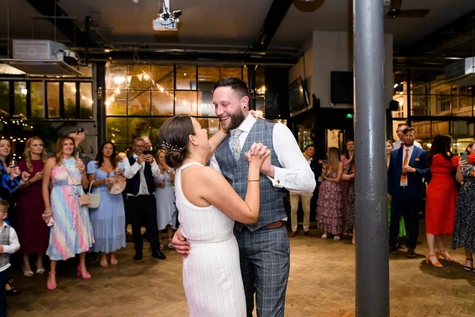 Bride and groom dancing together in front of guests at The Depot N7