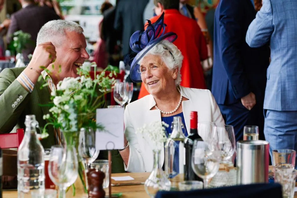 Old couple laughing whilst at a wedding reception at The Oyster Shed 