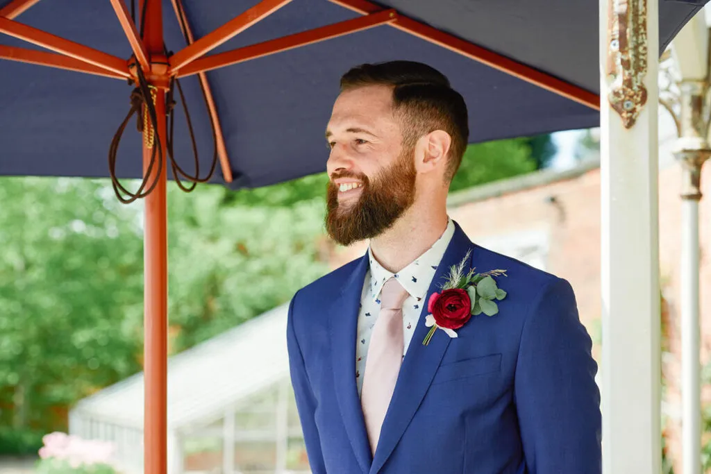 groom smiling during an outdoor summer wedding in Nottingham