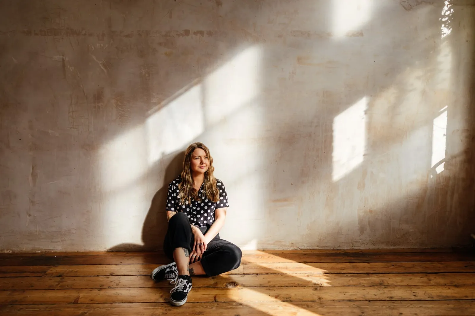 portrait of Nottingham wedding photographer sally rose in rustic studio