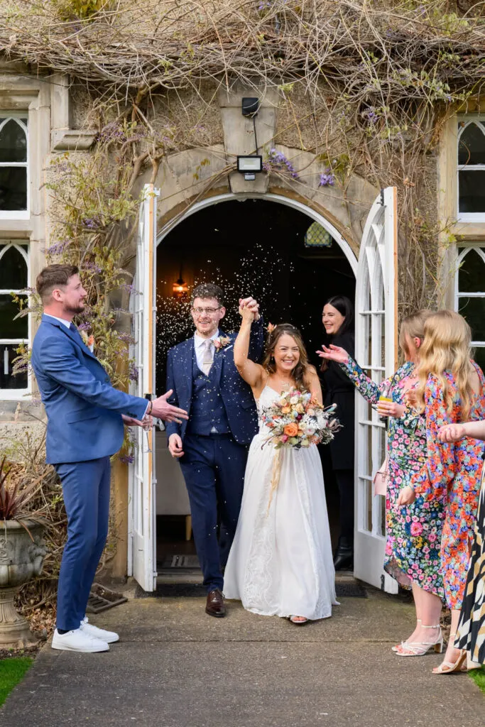 confetti moment outside woodborough hall wedding venue