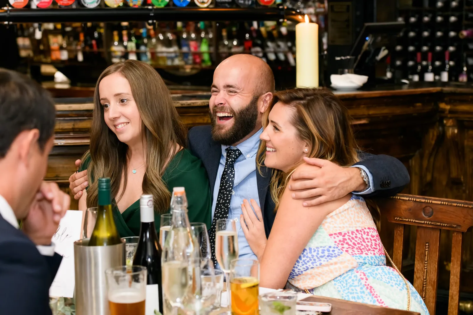 male guest laughing during The Depot N7 wedding reception meal