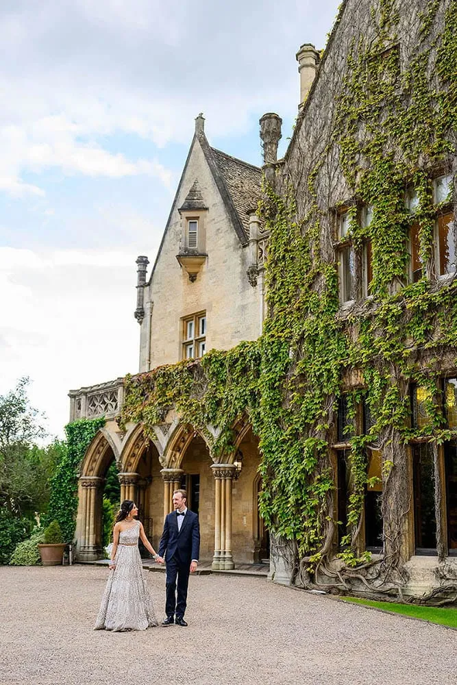 bride and groom walking together in front of nottingham venue