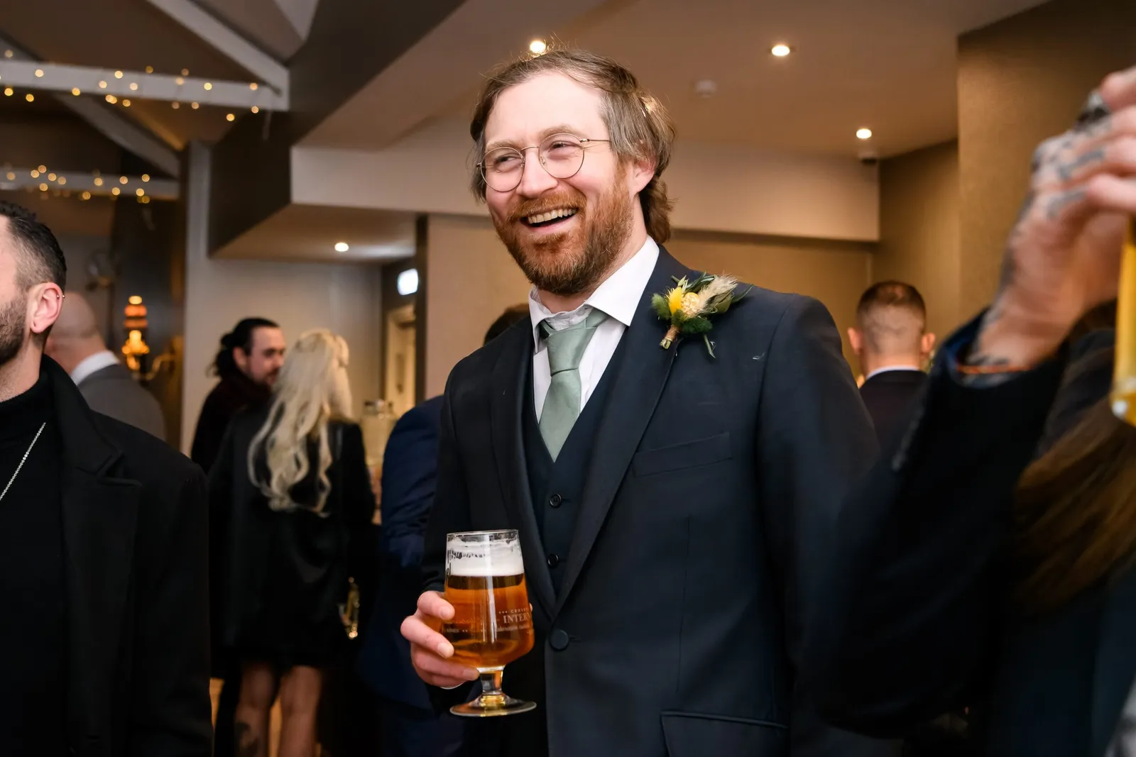 happy wedding guest laughing during evening reception at Cockliffe country house