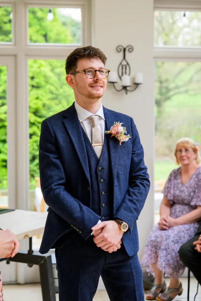 groom waiting for bride during orangery ceremony woodborough hall