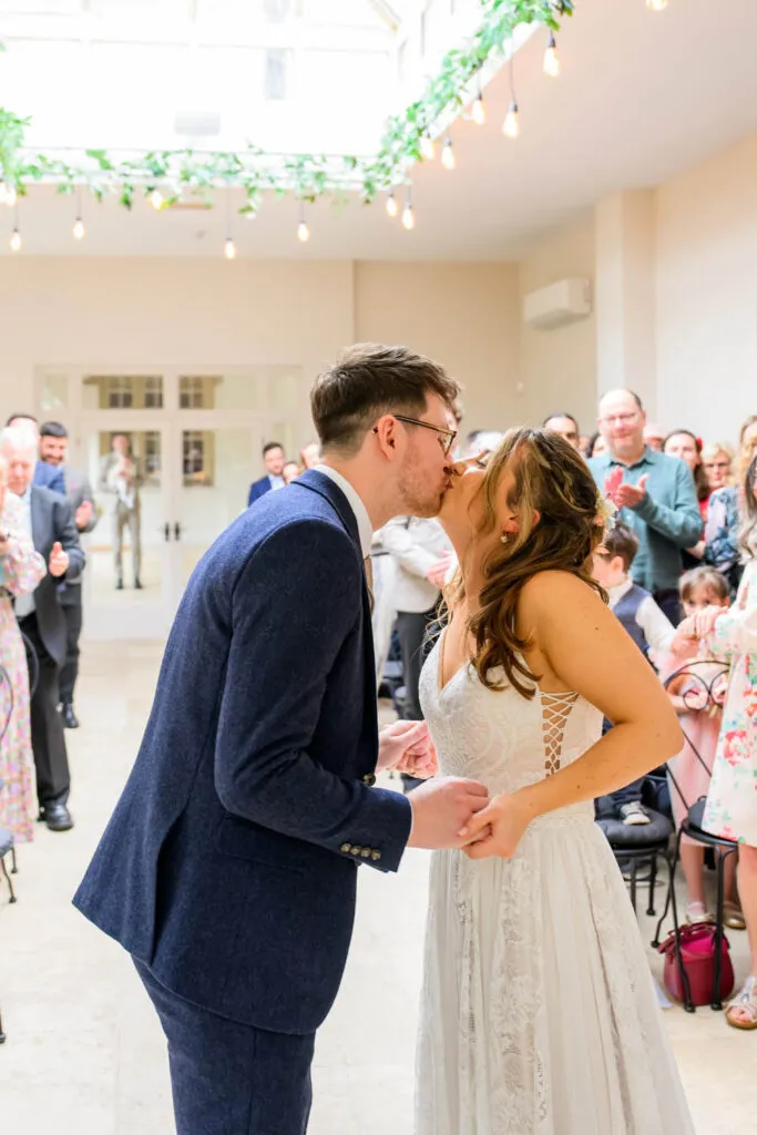 first kiss during orangery ceremony woodborough hall wedding photography