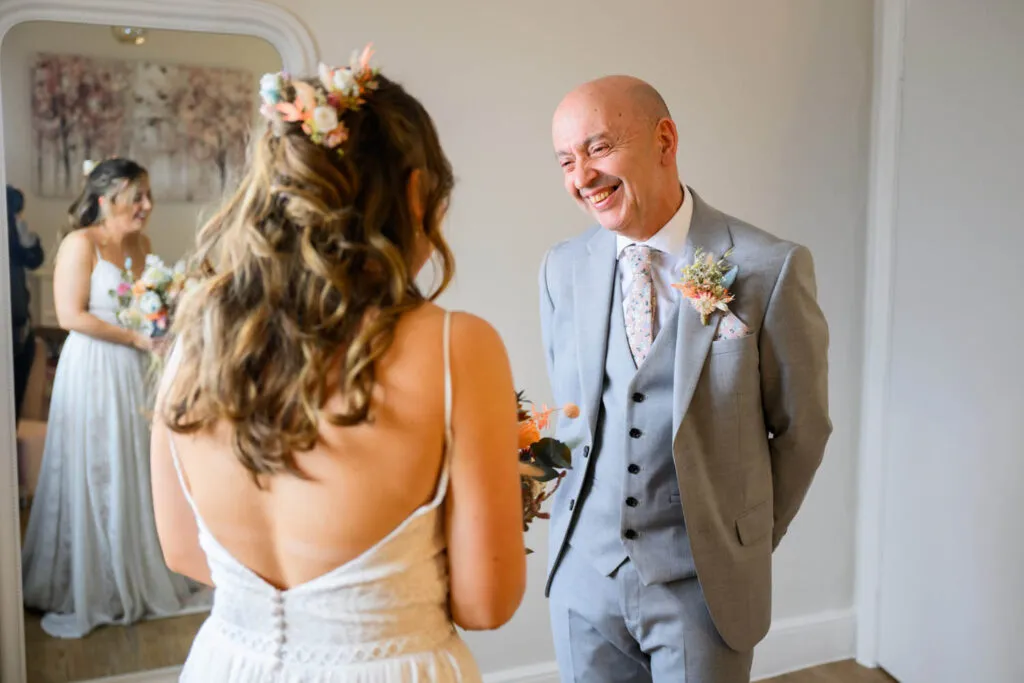 father seeing bride during emotional first look at woodborough hall wedding