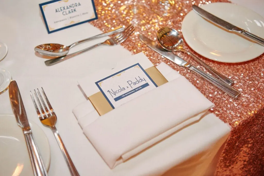 wedding favour mixed CD on gold sequinned table