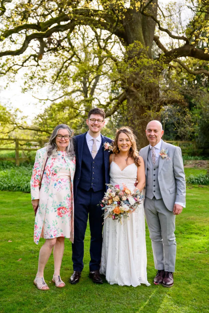 family portrait with bride and groom at woodborough hall wedding photography