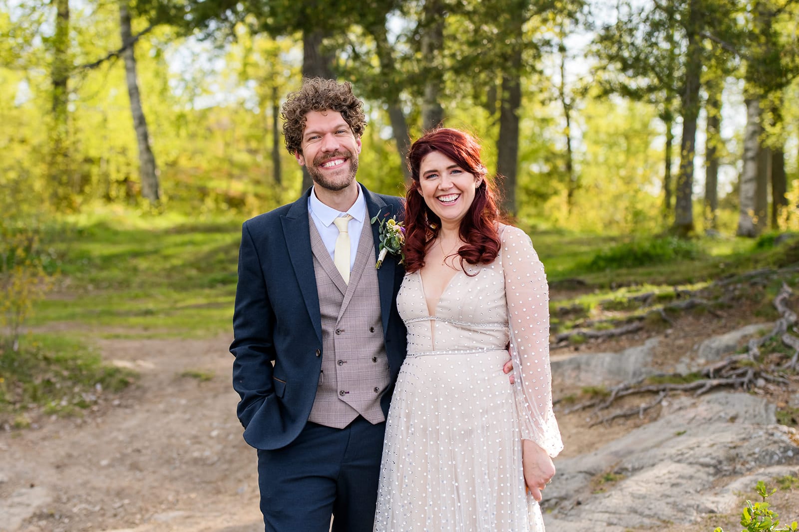 Happy wedding couple stood outside at the carriage hall in Nottingham